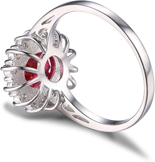 Elegancki pierścionek z białego złota z rubinem w otoczeniu halo