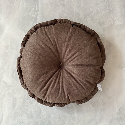 Puf okrągły z marszczeniem i centralnym guzikiem