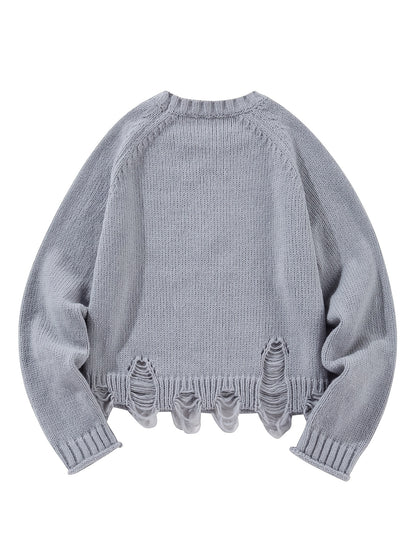 Sweter damski z okrągłym dekoltem z dekoracyjnymi przetarciami i równomiernym splotem