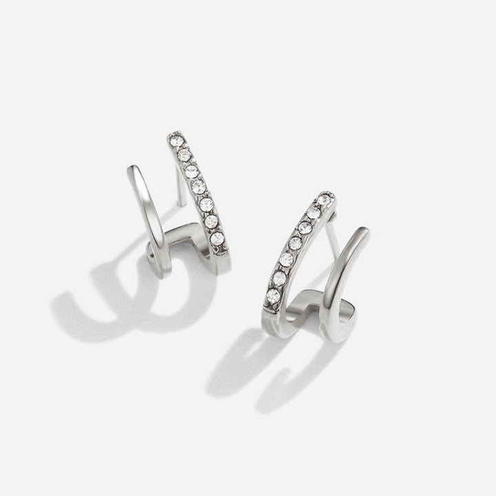 Srebrne kolczyki z kryształami w oprawie szponowej